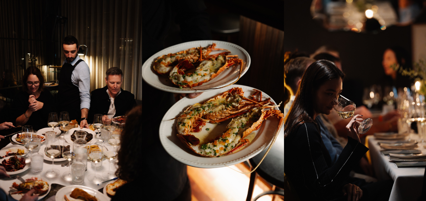 People dining at a table with plates of food, including a close-up of a dish with seafood.