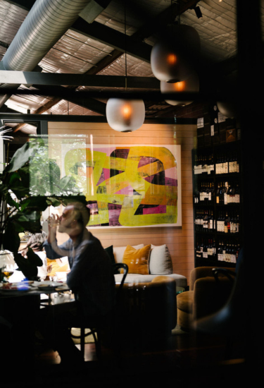 Wine wall and tasting tables inside Cherubino City Cellar wine bar in Subiaco, Perth