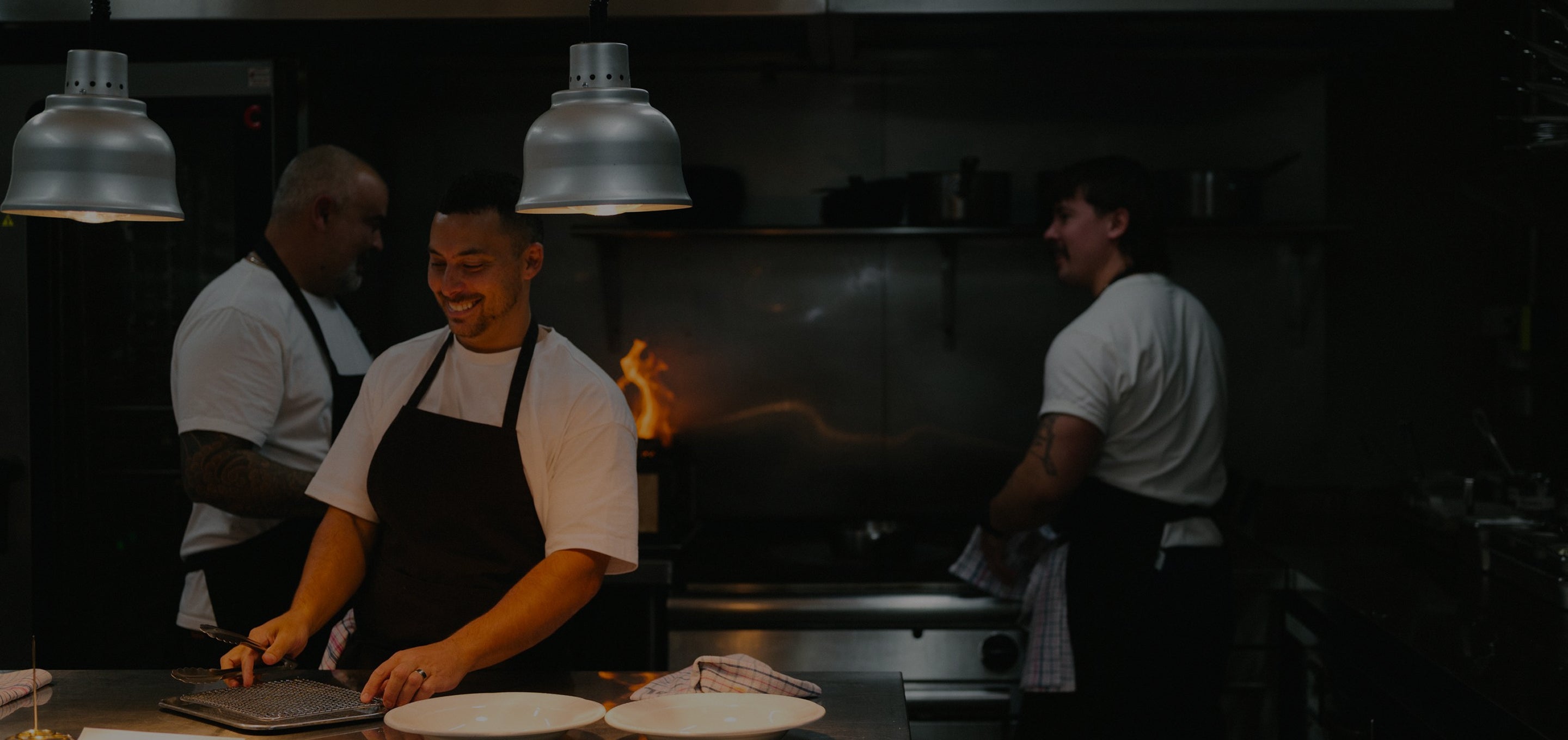Three chefs in a kitchen