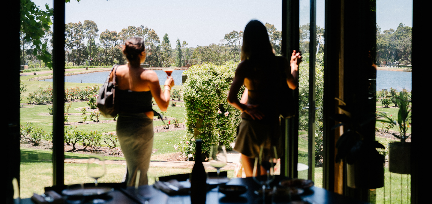 Guests enjoying a lakeside view from Masseria Restaurant overlooking the rose garden