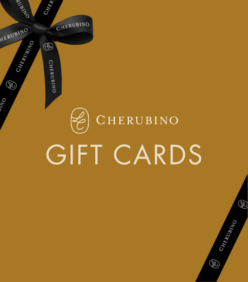 Cherubino gift card packaging with a black ribbon on a gold background